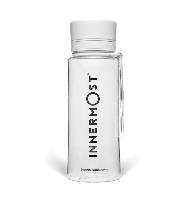 Innermost shaker bottle with a white lid and carry handle